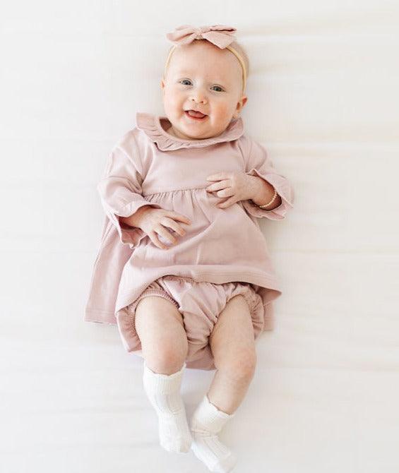 Baby in pink on sale dress